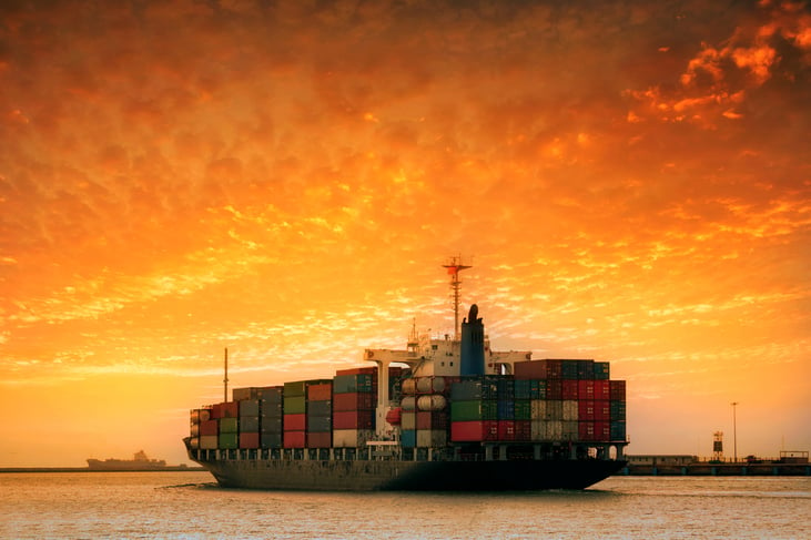 cargo-container-ship-mediterranean-coast-sunset-261864029