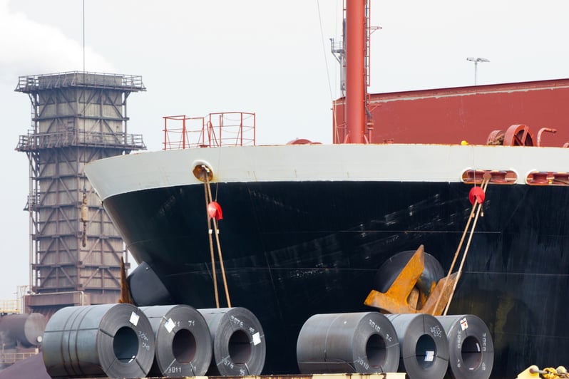 coiled-steel-sheets-being-loaded-ship-163999979