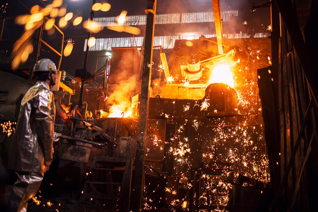 foundry-worker-controlling-process-melting-iron-1906539598
