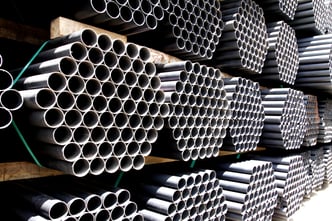 steel-pipes-bunch-on-rack-warehouse-145680545